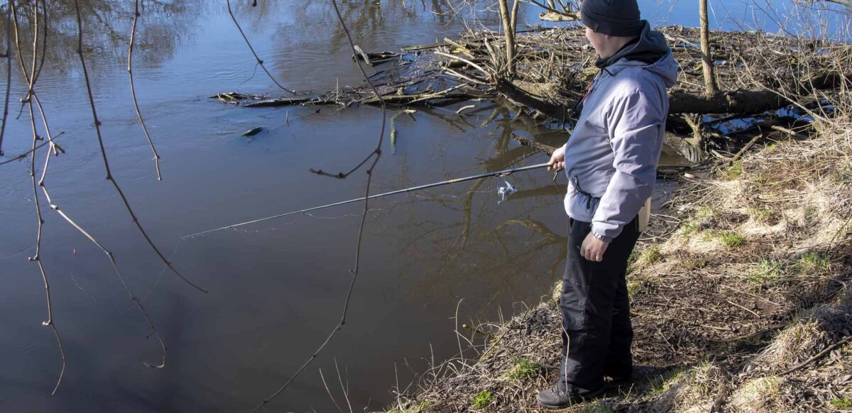 Man bass fishing from the bank