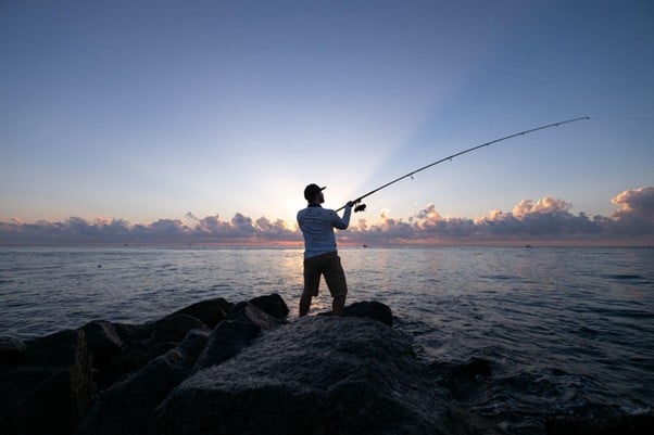 Fishing from the shore in waterproof boots