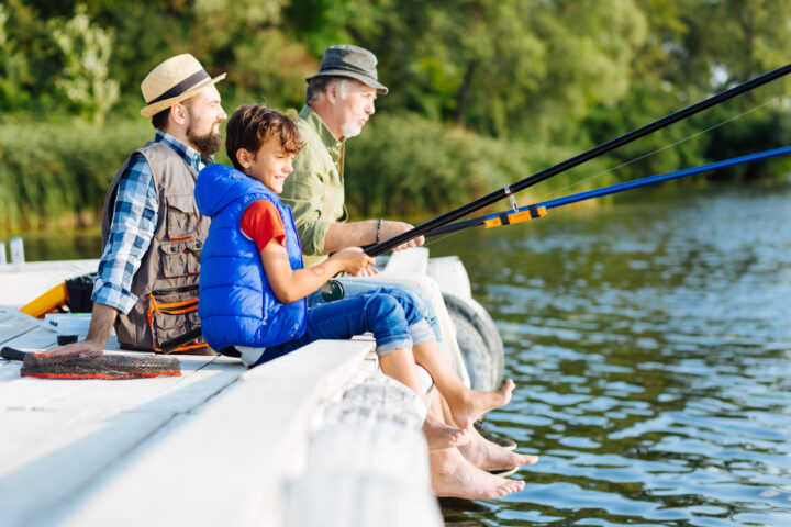 Men of three generations fishing all together